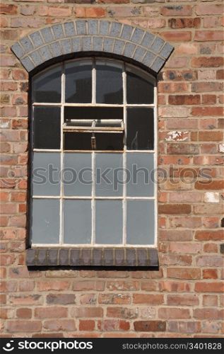 vintage wooden window on a brick wall building