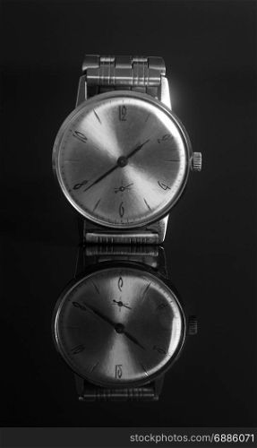 Vintage wrist watch on a black background