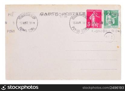 Vintage yellowed postcard back side, circa 1937, with old french post and meter st&s, with text Postcard and name of french village Mont Dore, isolated on white background