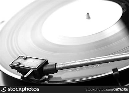 Vinyl record spinning on turntable close up