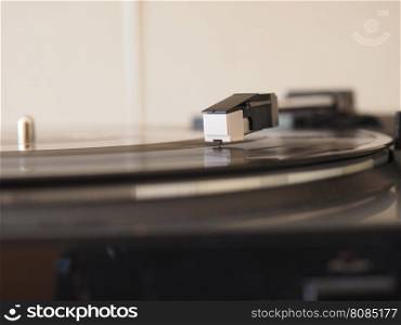 Vinyl record spinning. Vinyl record spinning on a turntable, focus on needle