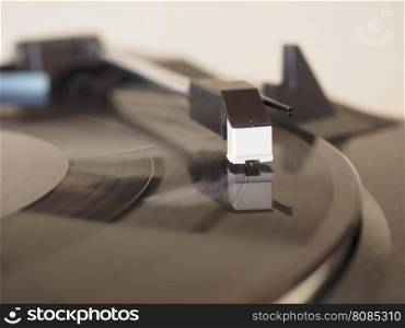 Vinyl record spinning. Vinyl record spinning on a turntable, focus on needle