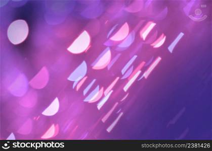 Violet abstract glowing background. Violet template for design. Abstract holiday celebration backdrop. Abstract purple glitter confetti burst background. Purple abstract glitter background