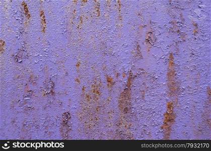 Violet purple painted grunge weathered rusty metal surface as background