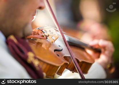 Violin performance close up. Violin performance at the concert white dress