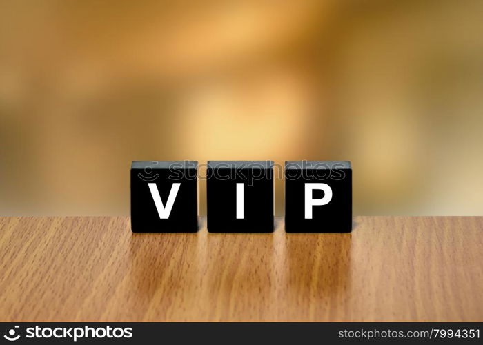 VIP or Very Important Person on black block with blurred background