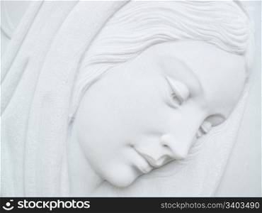 virgin mary. virgin mary on white marble tombstone