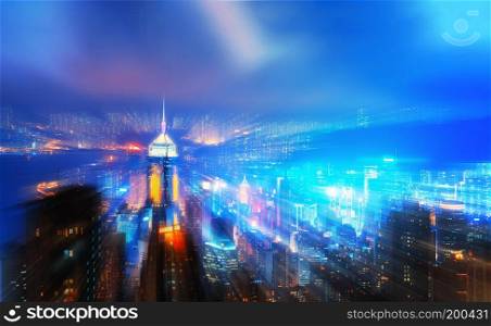Virtual city. Zoom motion effect of digital Hong Kong Downtown and Victoria Harbour. Financial district in smart city in technology concept. Skyscraper and high-rise buildings. Aerial view at night.