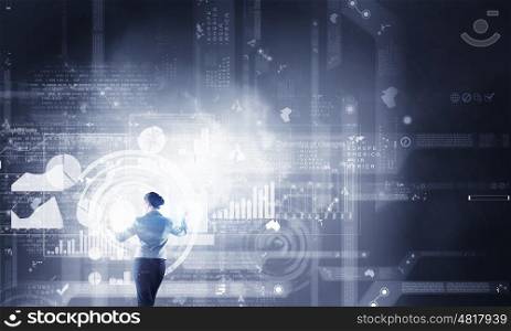 Virtual panel. Back view of businesswoman working with modern virtual technologies