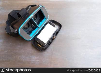 Virtual reality glasses - open one and phone with blank screen inside. Virtual reality glasses