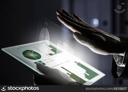 Virtual technologies. Close up of human hands using virtual panel