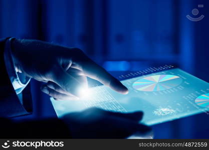 Virtual technologies. Close up of human hands using virtual panel