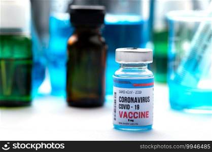 virus vaccine development of a coronavirus COVID-19, vaccine bottle in concept of insurance and fight against coronavirus 2019 ncov cure, medical research in laboratory to stop the spread of the virus
