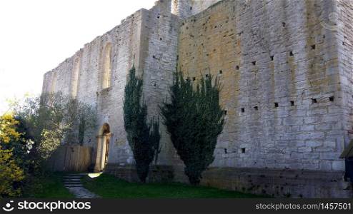 Visby, Sweden, May 5, 2019. A glimpse of the exterior of the walls of the ancient church in the old town of Visby in Gotland in Sweden. A glimpse of the exterior of the walls of the ancient church in the old town of Visby in Gotland in Sweden
