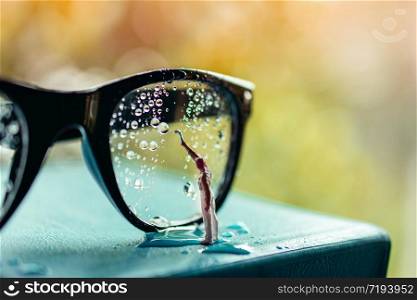 Vision Concept. Miniature Cleaner Wipe out Many Droplet on Eyeglasses to Clear