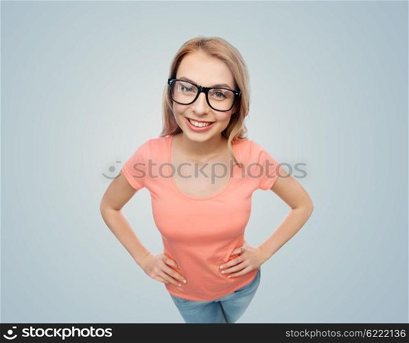 vision, education and people concept - happy smiling young woman or teenage girl eyeglasses over gray background