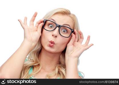 vision, education and people concept - happy young woman or teenage girl glasses making funny fish face