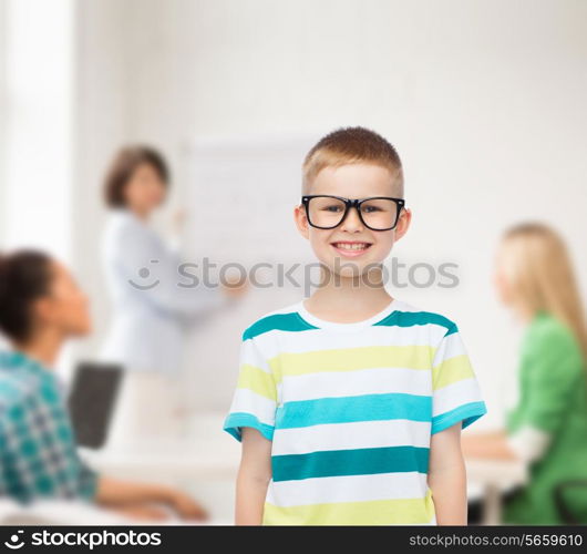 vision, education and school concept - smiling little boy in eyeglasses over white background