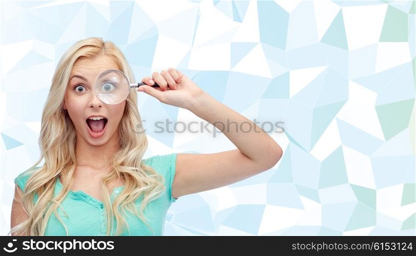 vision, exploration, investigation, education and people concept - happy smiling young woman or teenage girl looking through magnifying glass over blue low poly background