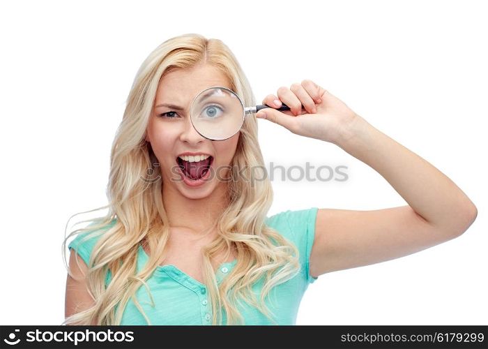 vision, exploration, investigation, education and people concept - happy smiling young woman or teenage girl looking through magnifying glass