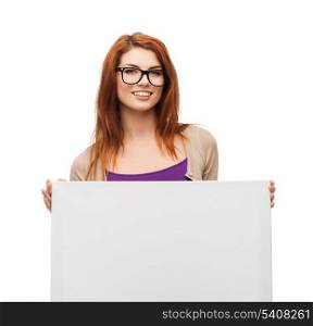 vision, health, advertisement and people concept - smiling girl wearing eyeglasses with white blank board