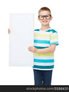 vision, health, advertisement and people concept - smiling little boy wearing eyeglasses with white blank board