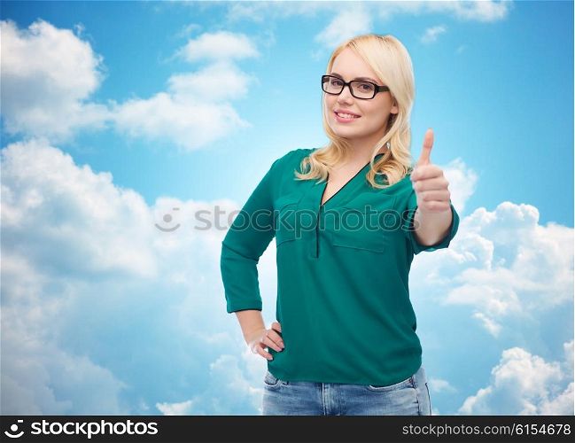 vision, optics, education, gesture and people concept - smiling young woman with eyeglasses showing thumbs up over blue sky and clouds background