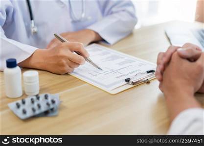 Visiting a doctor concept A doctor rating health condition of his patient while listening to his patient&rsquo;s symptom