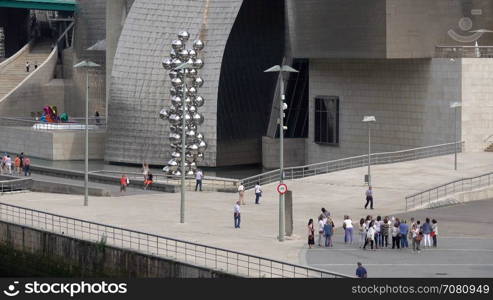 Visitors near the Tall Tree & The Eye sculpture of the Guggenheim Bilbao