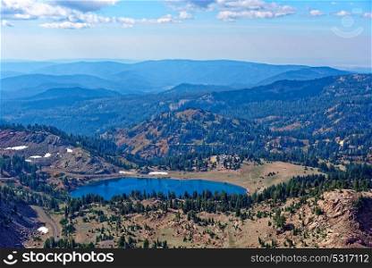 Vista from Lassen Peak in Lassen Volcanic National Park featuring Lake Helen in the foreground