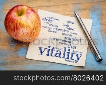 vitality and vital energy word cloud - handwriting on a napkin with a fresh apple