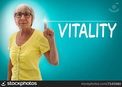 Vitality touchscreen is shown by Senior woman concept.. Vitality touchscreen is shown by Senior woman concept
