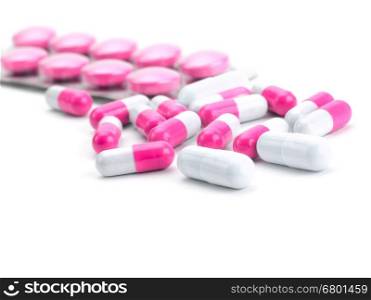 vitamins, pills and tablets on white