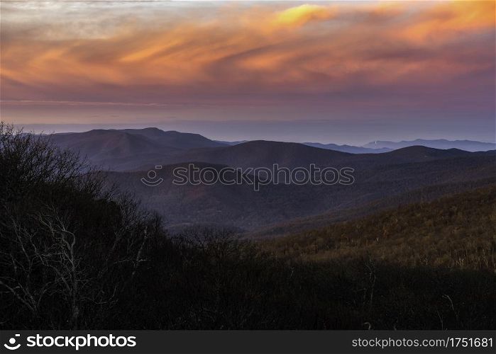 Vivid clouds at sunrise over Shenandoah National Park in the Winter viewed from Mount Marshall.