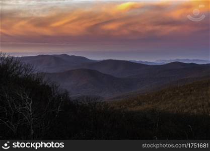 Vivid clouds at sunrise over Shenandoah National Park in the Winter viewed from Mount Marshall.