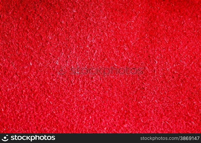 Vivid red natural leather texture closeup background, skin design abstract pattern.