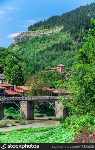 Vladischkiyat bridge over the Yantra River near Veliko Tarnovo Fortress, Bulgaria. Big size panoramic view on a sunny summer day. Vladischkiyat bridge near Veliko Tarnovo Fortress, Bulgaria