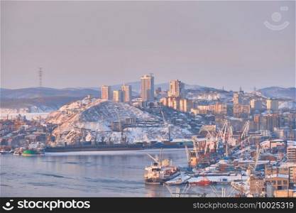 Vladivostok, Russia - Jan 28, 2021  Evening view of the city from the Eagle’s Nest hill. The city after a snowstorm. Vladivostok, Russia - Jan 28, 2021  Evening view of the city from the Eagle’s Nest hill. The city after a snowstorm.