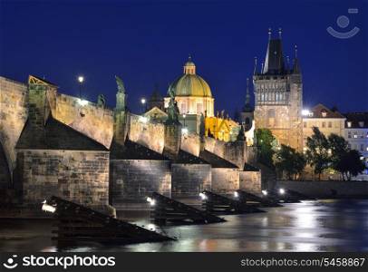 Vltava river, Charles Bridge and Old Town Bridge Tower in Prague at night. Karluv Most. Czech Republic