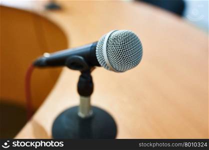 Vocal Dynamic Microphone on the table at Conference