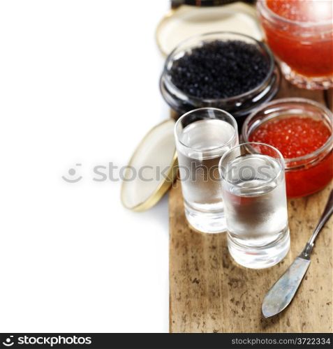 Vodka and caviar over white