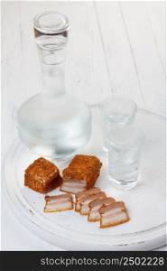 Vodka and salted lard with spices, traditional ukrainian recipe