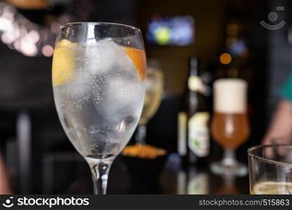 vodka glass with slice of lemon and orange