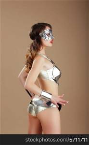 Vogue. Woman in Silver Mask and Cyber Steel Costume