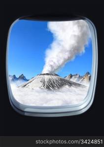 volcanic eruption view from the window of plane