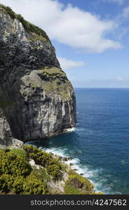 Volcanic geologic formation of Morro de Castelo Branco in Faial island, Azores, Portugal