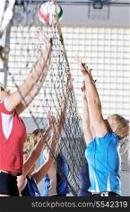 volleyball game sport with group of girls indoor in sport arena
