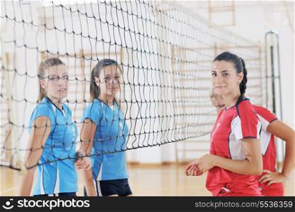volleyball game sport with group of young beautiful girls indoor in sport arena