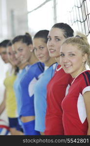 volleyball game sport with group of young beautiful girls indoor in sport arena