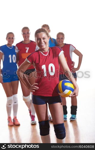 volleyball game sport with group of young beautiful girls indoor in sport arena ball net